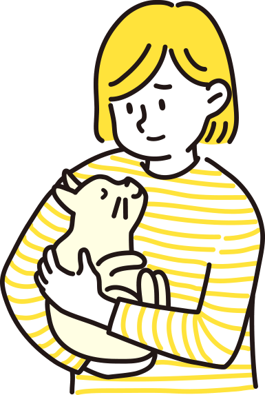猫を抱きかかえる女性